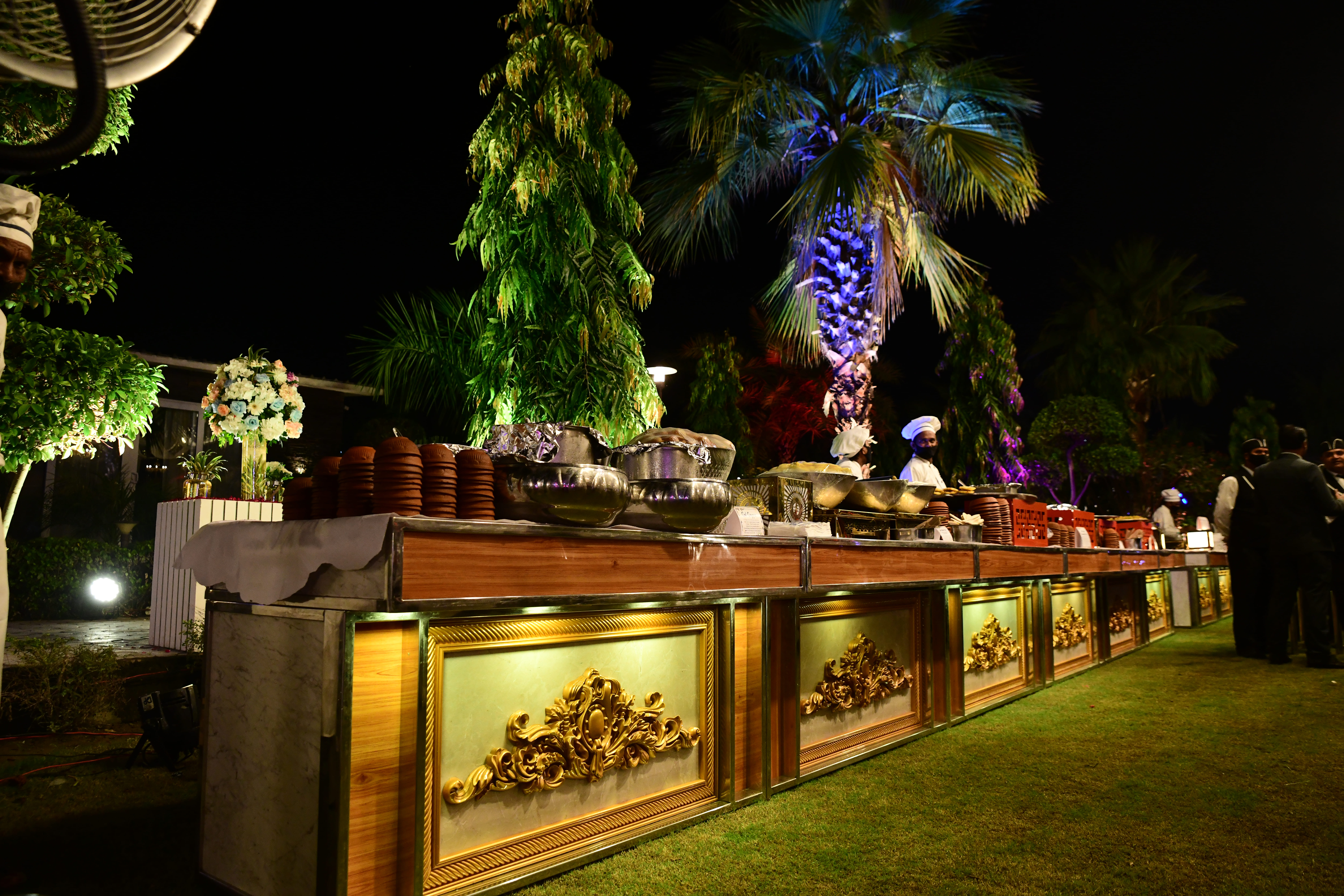 Outdoor catering station at night in Greater Noida